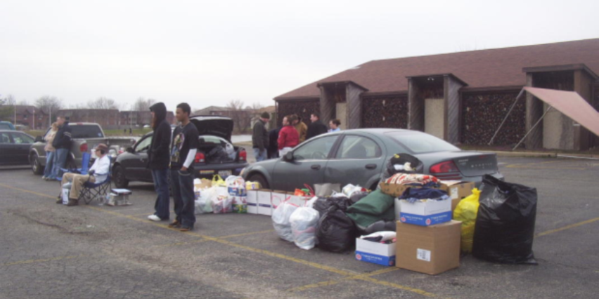 DA DIZZEE CREW as some of them gather around the grill to stay warm.